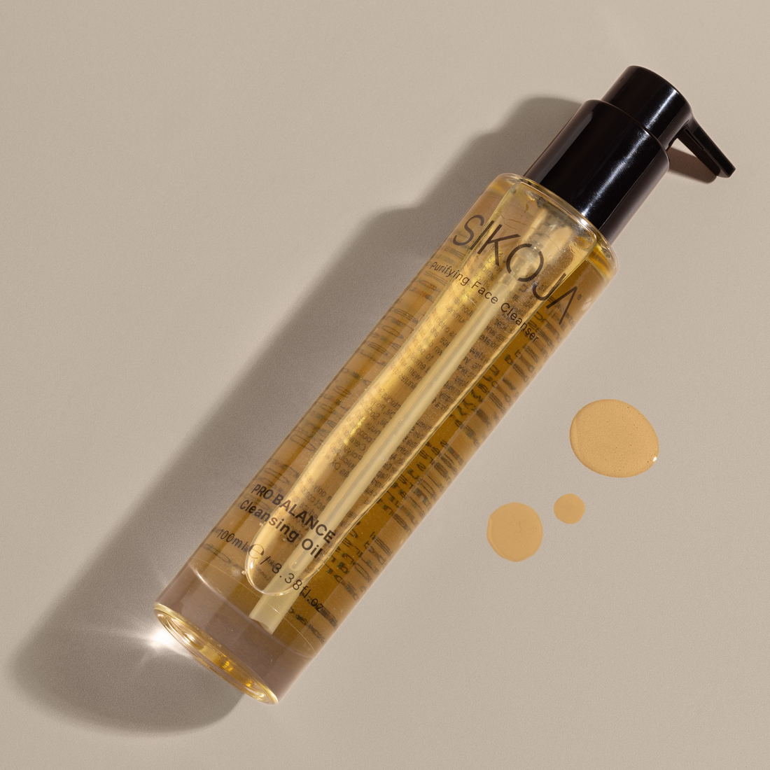 pro balance cleansing oil laying down with liquid drops