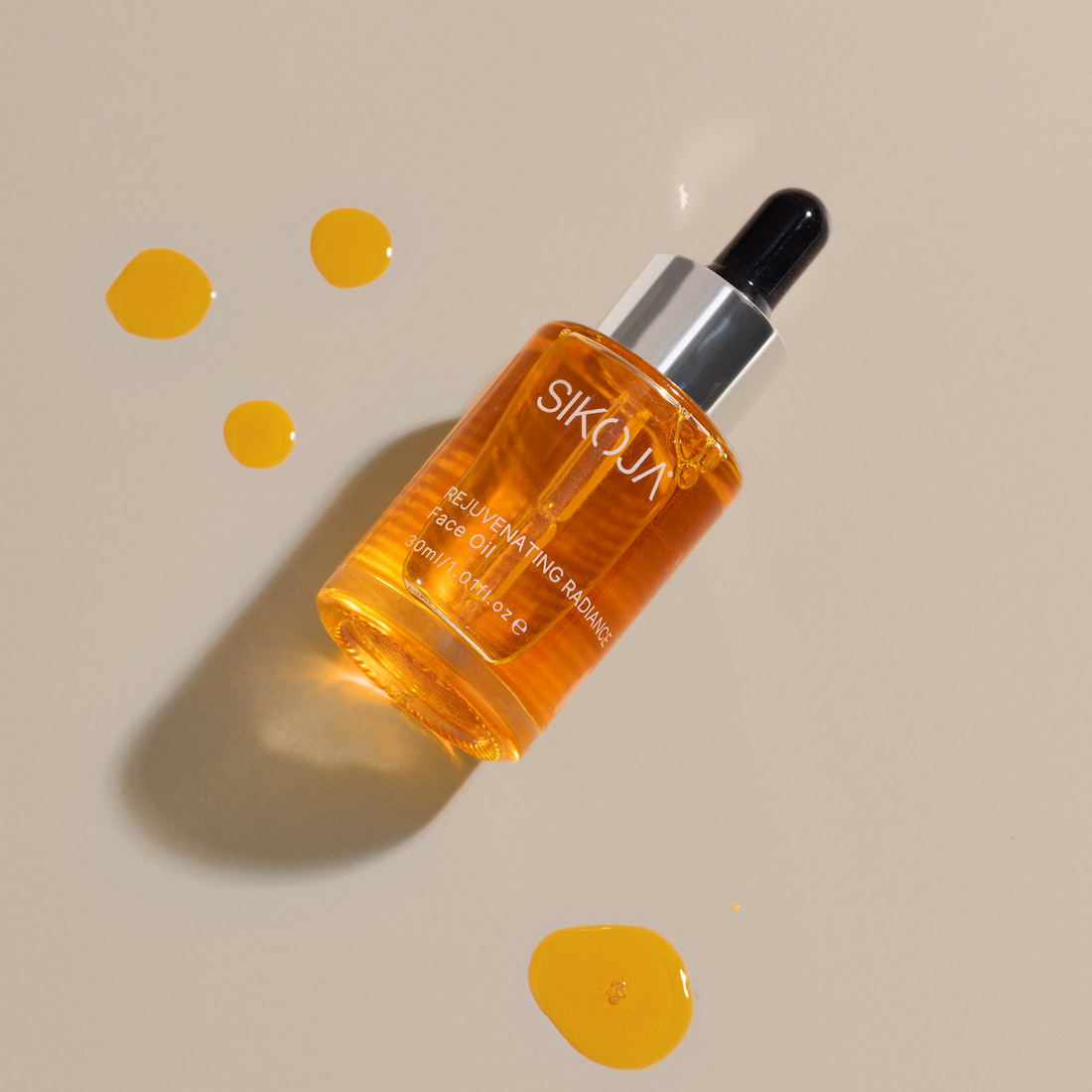 rejuvenating radiance laying down with oil drops